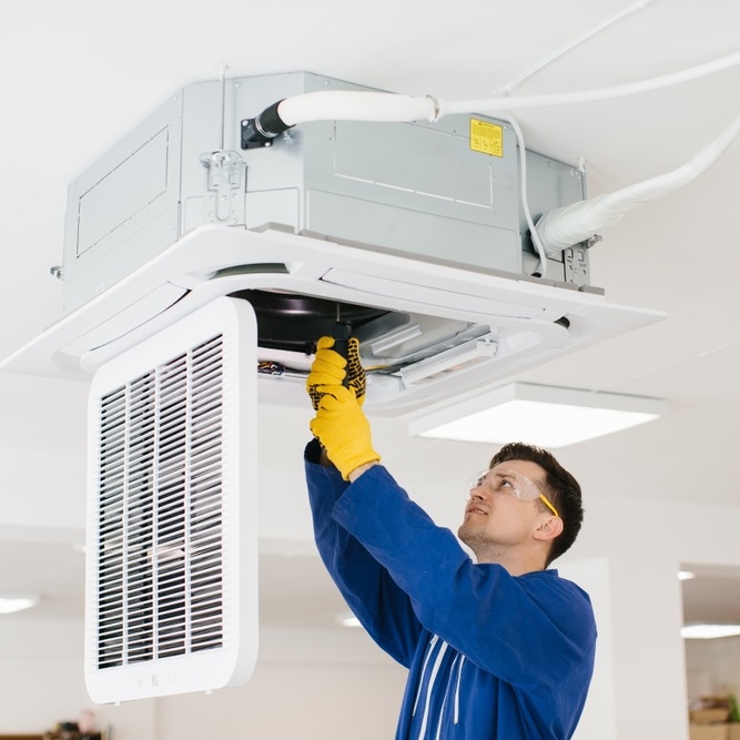 Hvac,Technician,Wearing,Safety,Glasses,And,Gloves,Installing,An,Air